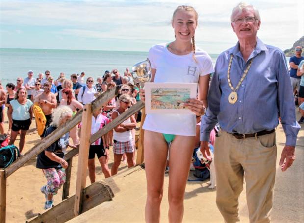 Isle of Wight County Press: Millie Willams was the fastest Island woman, receiving her trophy from Shanklin mayor, Cllr Chris Quirk. 