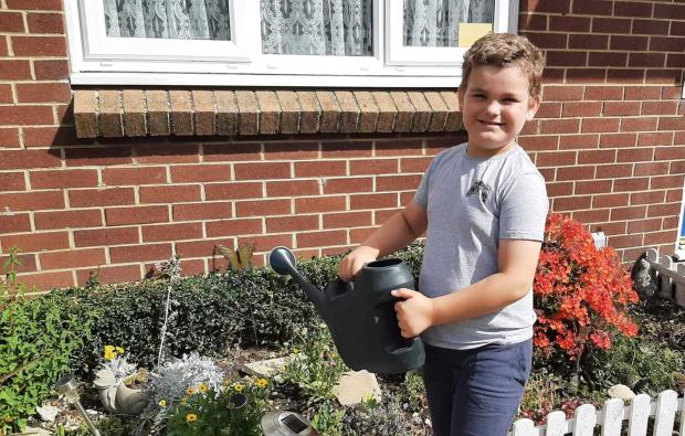 Isle of Wight County Press: Alfie Saunders gets ready for the ban by using his watering can.