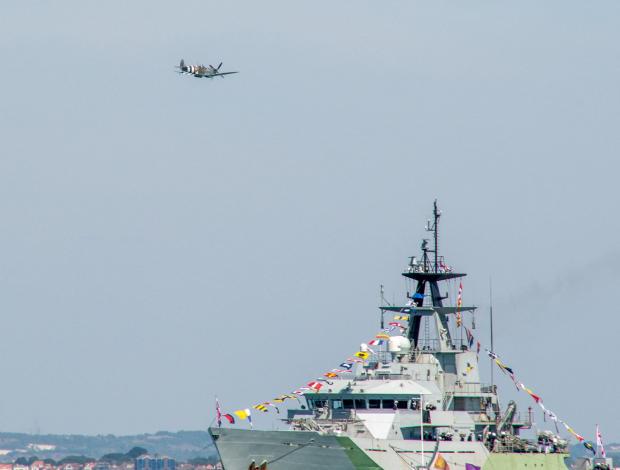 Isle of Wight County Press: Spitfire over HMS Severn by Chris Mathews.