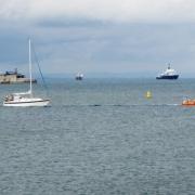 Photo of RNLB Norman Harvey escorting the yacht into Bembridge Harbour, by Mike Samuelson, courtesy of Bembridge RNLI Lifeboat.