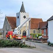 Firefighters at Newchurch making the spire of the parish church safe following damage caused by Storm Eunice.