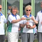 Ryde Marina Bowling Club co-event organiser, Anne Hoath,  presenting the Frank Sansom Trophy to Liz Allen, of the winning trio, with team-mates Dave Wolton, left, and John Wright.