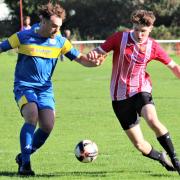 Toby Snow, right, was on target for East Cowes Vics at high-flying Downton.  Photos: Graham Brown