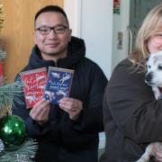 RSPCA ) fundraiser Rebecca Busby and fundraising officer Ivan Chau with Tilly.