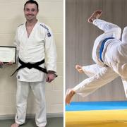 Kerick Sampson receiving his First Dan grade certificate from Su Webster, on behalf of the British Judo Association.