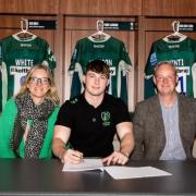Rugby star Rory Taylor signing his contract. Picture by London Irish.
