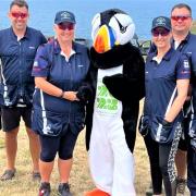 The clay shooting team with Jet the Puffin, the Island Games mascot..