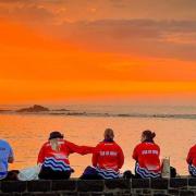 Members of Team IOW enjoying a spectacular Guernsey sunset.