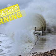 Waves crash against the seawall in Totland. A warning is in force today.