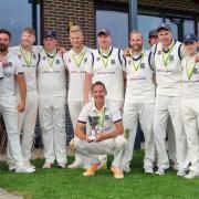 The Newport cricket team with their hard-fought trophy.