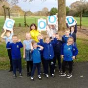 St Helens Primary School pupils' celebrating their Ofsted result.