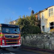 One hurt and road closed after Brading house fire