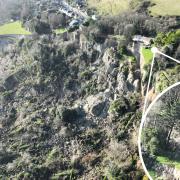 The landslip and a close up of one of the affected properties.