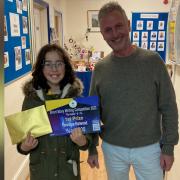 Penelope Harwood, 8-11 years winner, pictured with Chris Cane of Sight for Wight