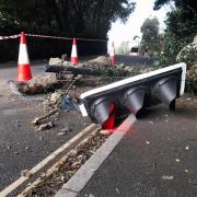 Rock fall wipes out traffic light.