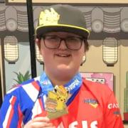 Cass Morey, with his latest Pokemon medal