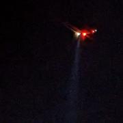 A Solent Coastguard helicopter using a searchlight over East Cowes harbour last night (Saturday).
