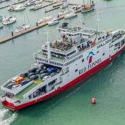 X logo and Red Funnel ferry