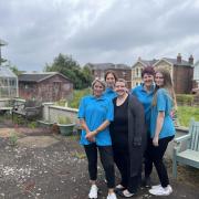 Staff in the garden at Easthill Home for Deaf People in Ryde